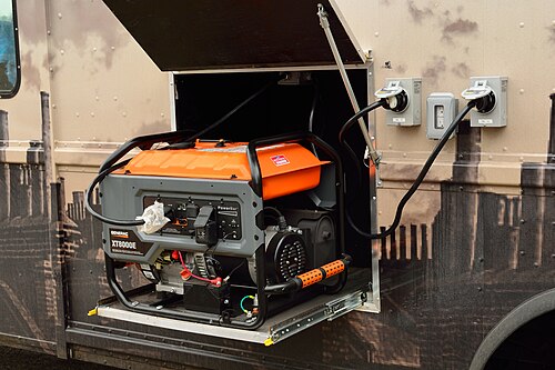 A portable petrol generator in an open metal frame with an orange fuel tank