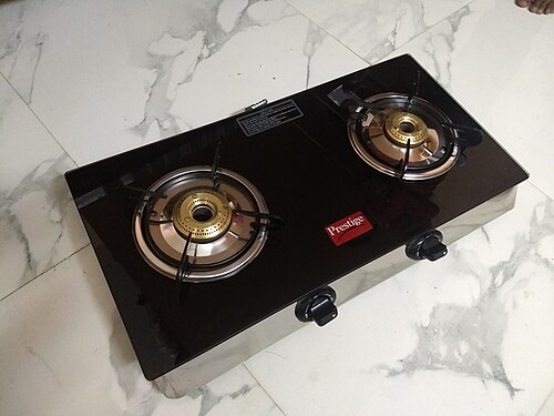 A black tabletop gas cooker with two burners and front control knobs